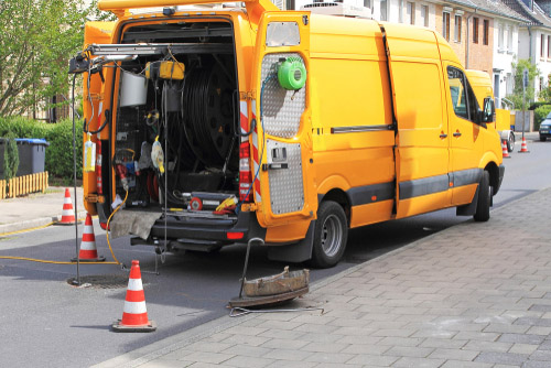 Knight Sewer and Drain Van on the road